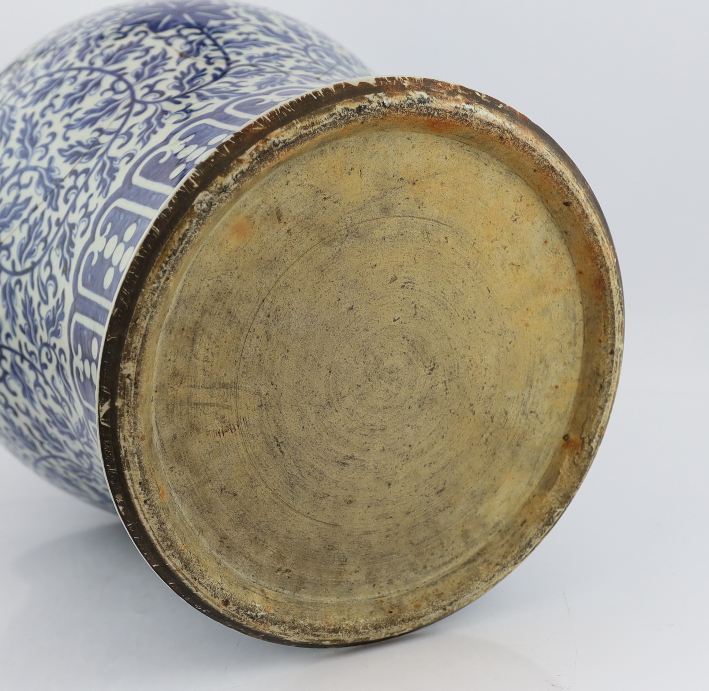 A massive Chinese blue and white ‘lotus’ vase and cover, 18th/19th century, broken and glued
